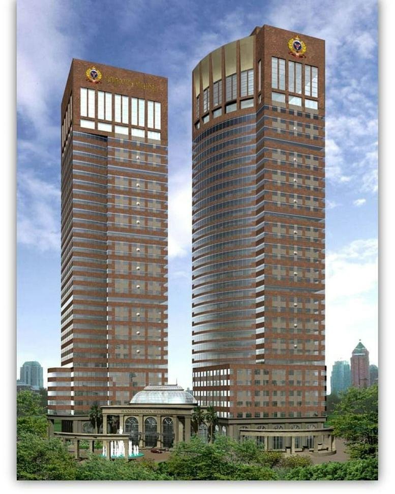 Exterior view of the twin brick and glass towers at Talavera Office Suite.