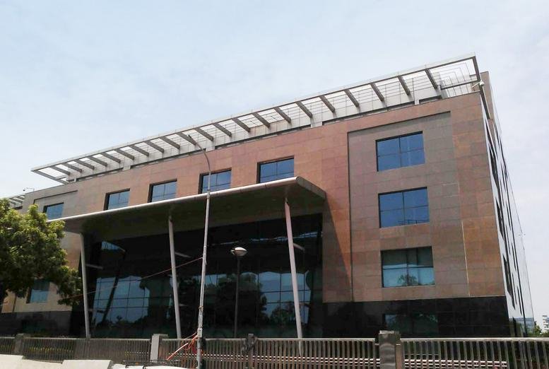 Exterior view of the modern brick and glass facade at Tamarai Tech Park.