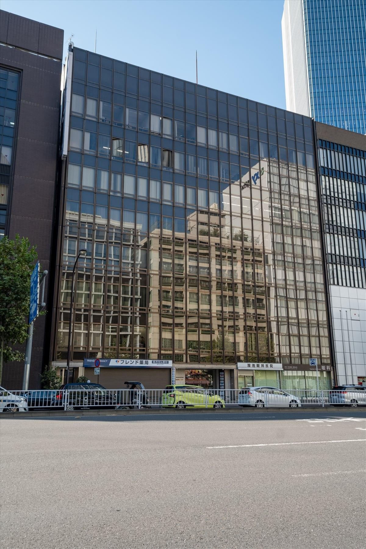 Exterior view of the glass-facade Habitation Akasaka building at 1-3-5 Akasaka.
