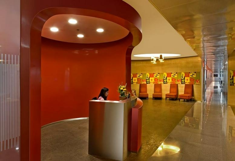 Reception area at Techpark One (C - Wing), Airport Road, Yerwada, Pune, India featuring a curved red feature wall.
