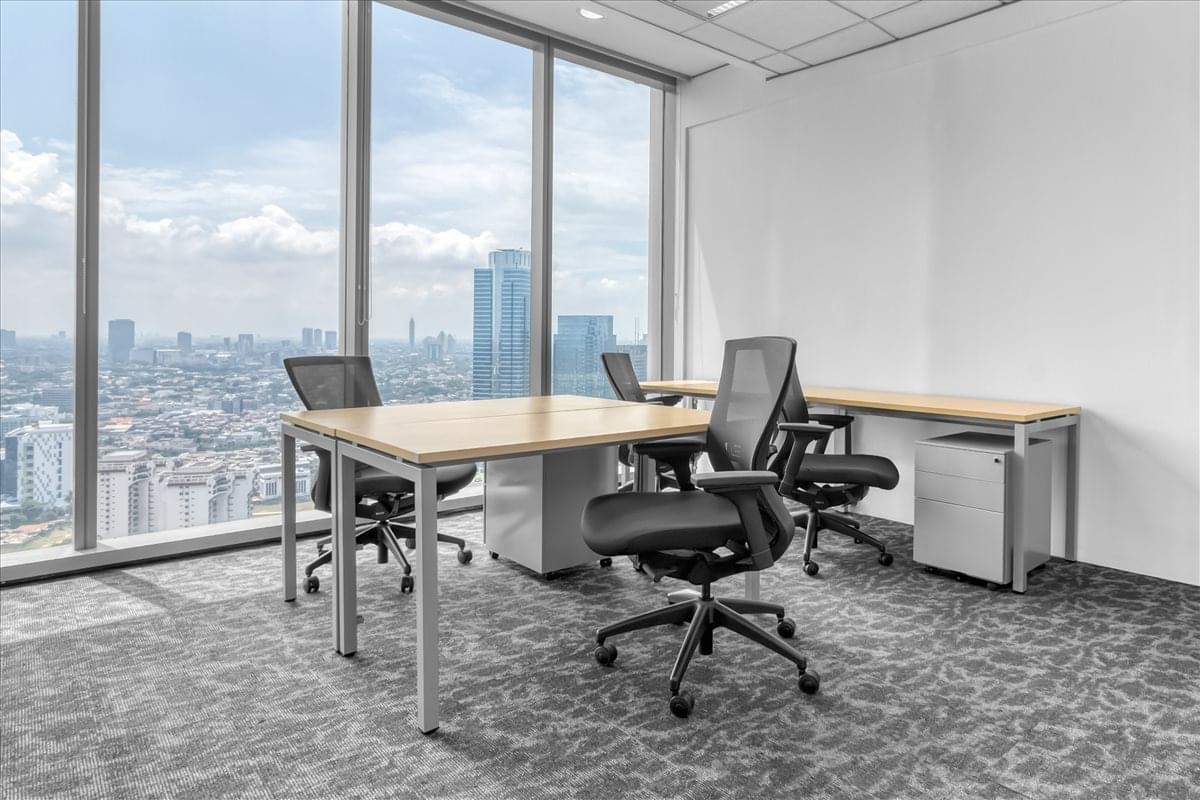 Spacious corner office with wooden desks and panoramic city views at Tempo Scan Tower.