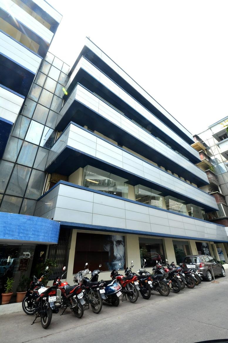 The sleek modern facade of the Tex Centre, E Wing building at Chandivali Farm Road.