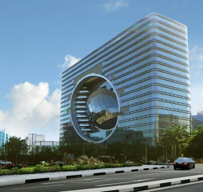 Exterior view of The Capital featuring its unique glass facade and central sphere design.