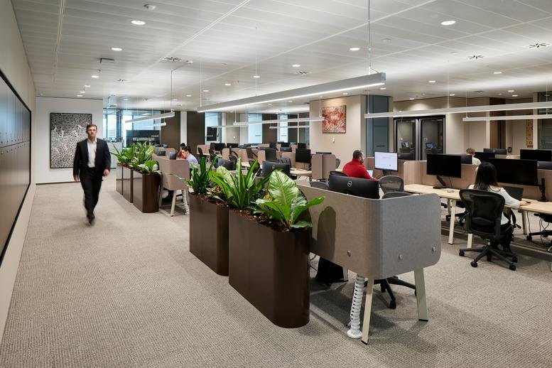 Professional workspace at Three International Towers Sydney with greenery and ergonomic furniture.