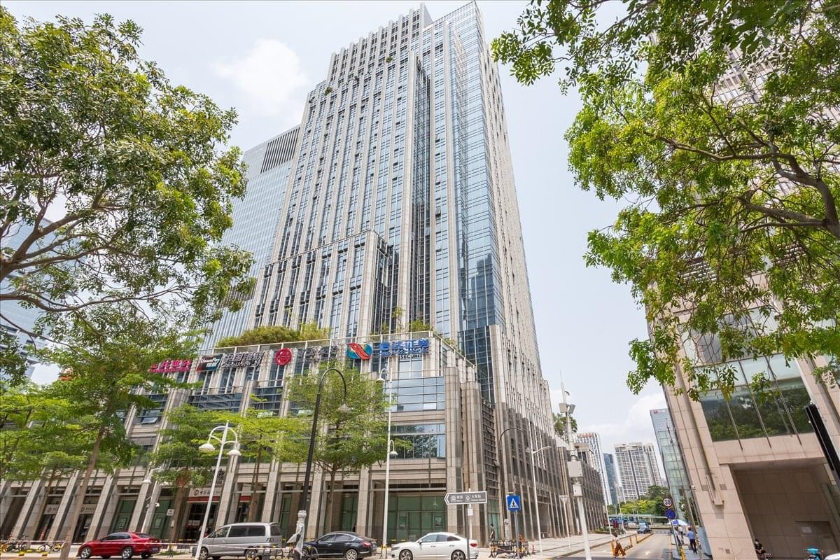 Exterior view of the glass and stone skyscraper at Times Financial Center.