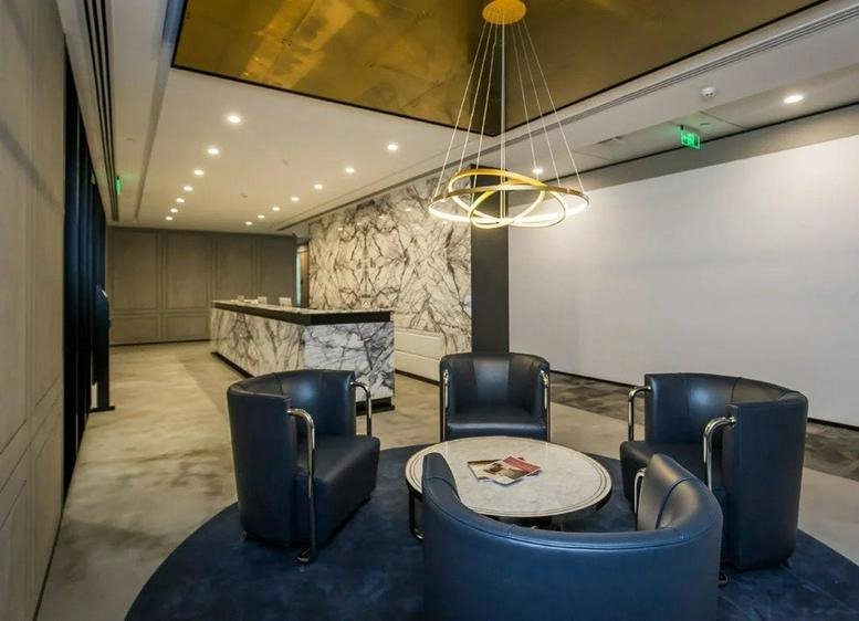 Sleek reception area at Tower 1, Kerry Plaza featuring a marble desk and contemporary seating.