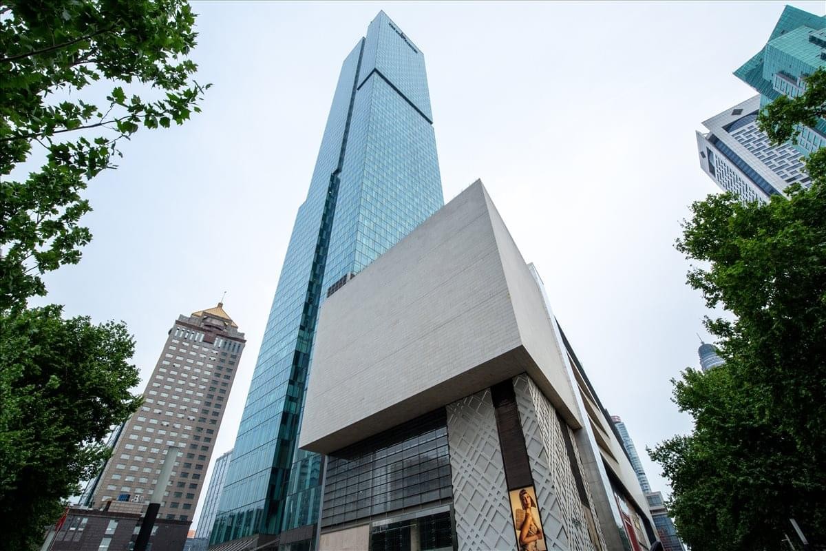 Exterior view of Tower 2, Deji Plaza with a glass facade and modern design.