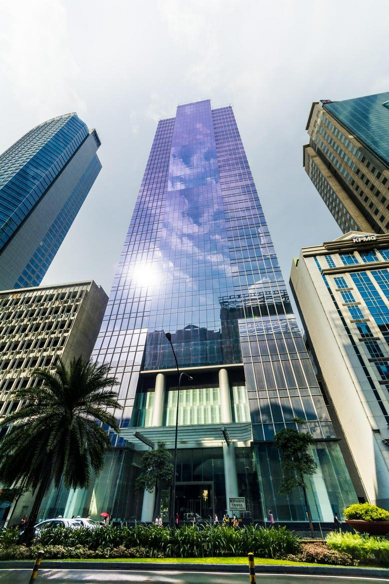 Exterior view of the impressive glass-facade Tower 6789 rising above the Makati skyline.