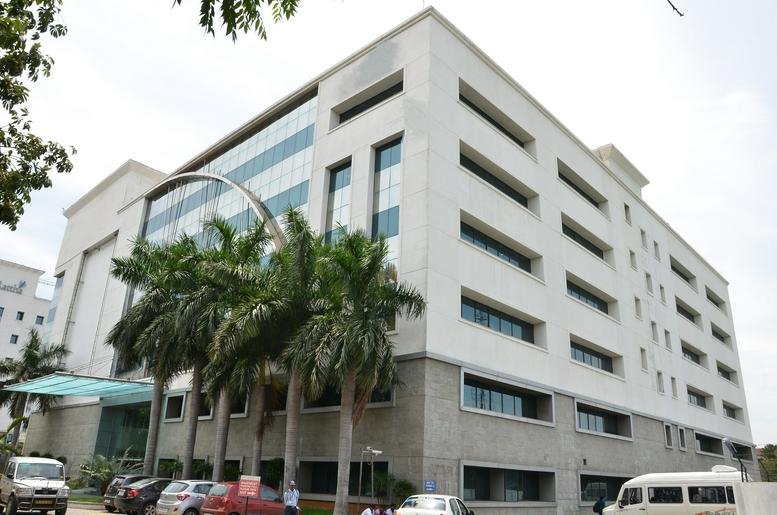 Exterior view of the white facade at Tower A, TEK Meadows.