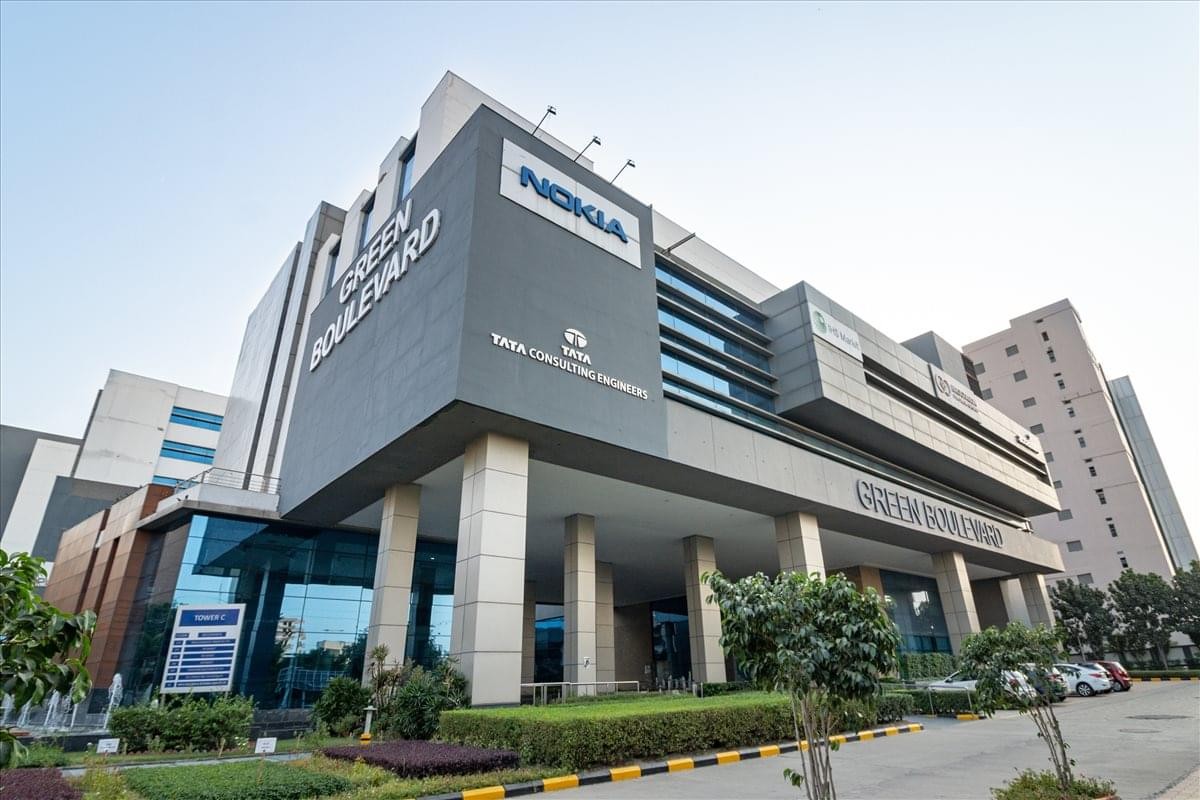 Exterior view of the modern glass and grey facade at Tower C, 5th Floor, Green Boulevard.