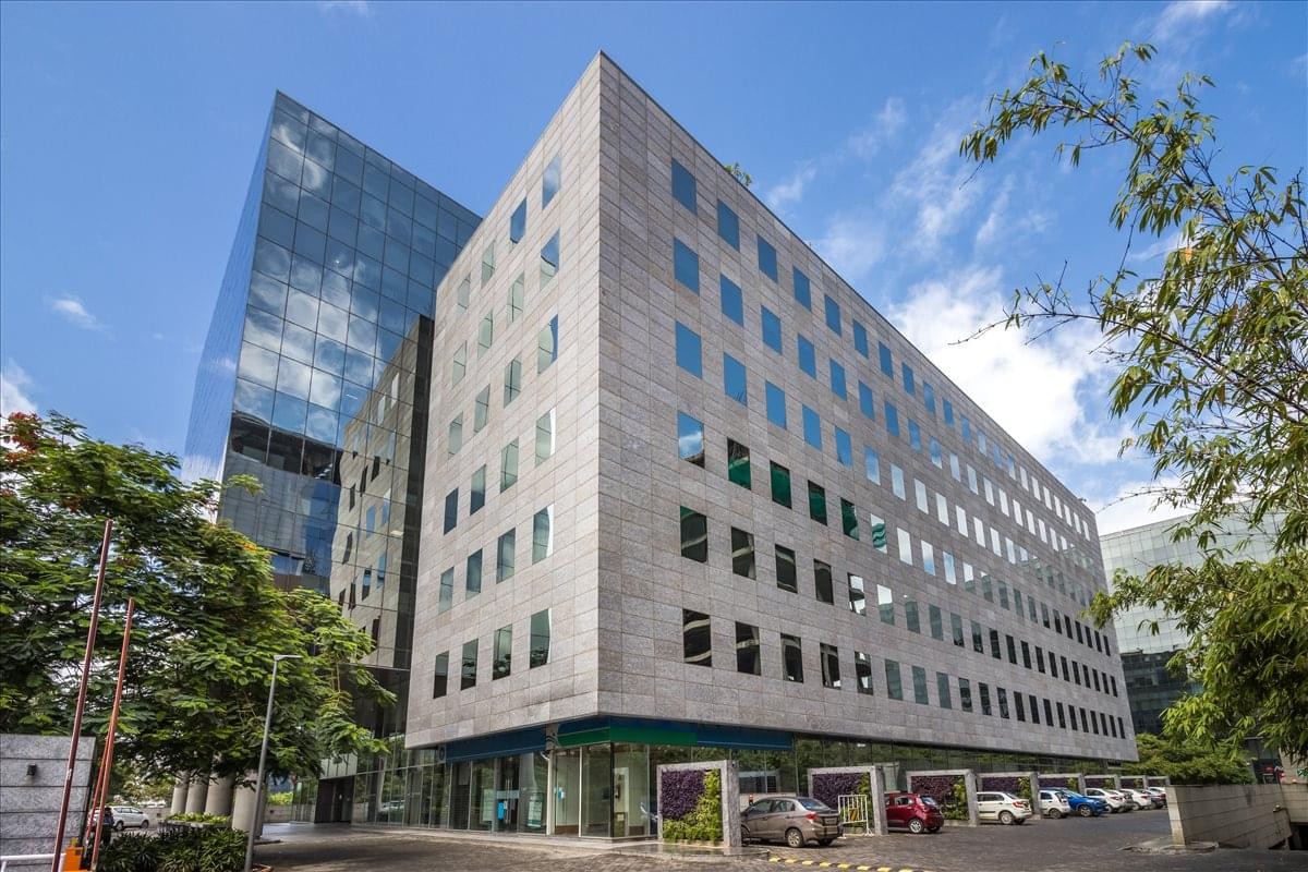 Exterior view of the modern stone and glass facade of the World Trade Centre in Pune.