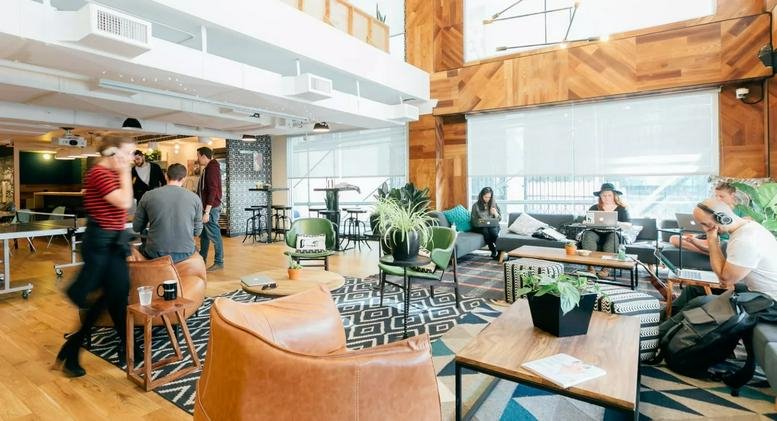 Spacious communal lounge at Xujiahui, No. 1901 Huashan Lu featuring wood-paneled walls and mid-century furniture.