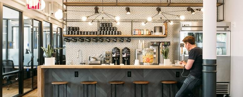 Modern café and breakout area at Yeoksam Station, 142 Teheran-ro, Seoul featuring a bar with stools.