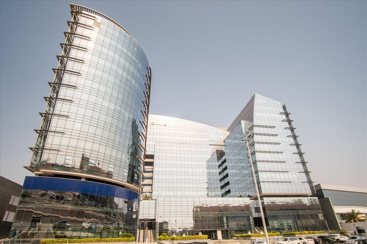 Exterior view of the modern glass-facade towers at Zahran Business Centre.