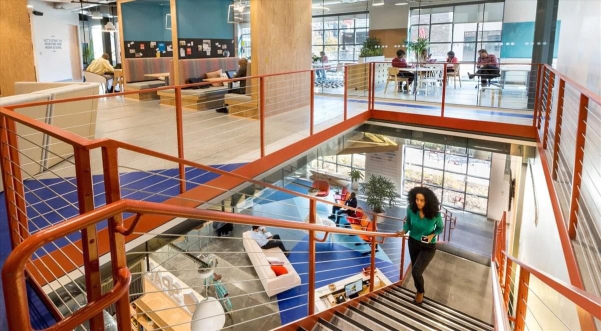 Modern multi-level workspace at Omar Ibn Omaya Al Damri Street with industrial stairs.