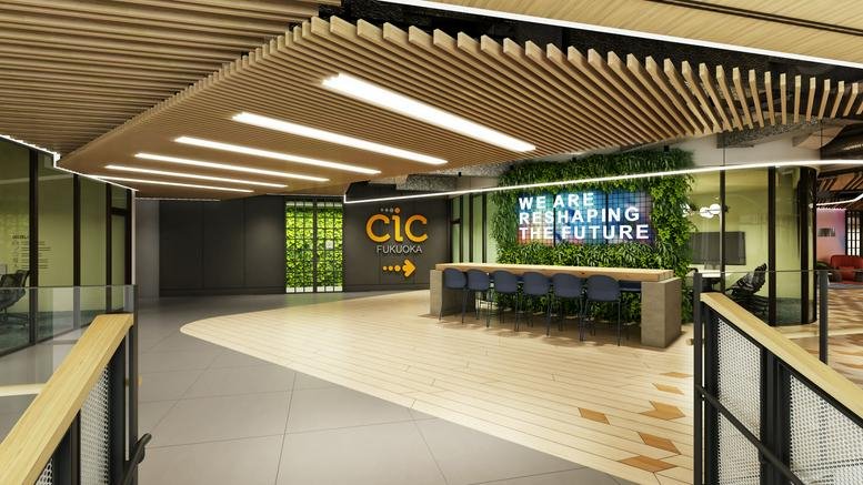 Modern reception lobby with warm wood slat ceilings, greenery wall, and branded signage.