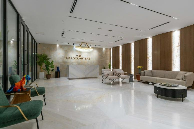 Spacious lobby with marble floors and lounge seating at Orbit, Hyderabad Knowledge City.