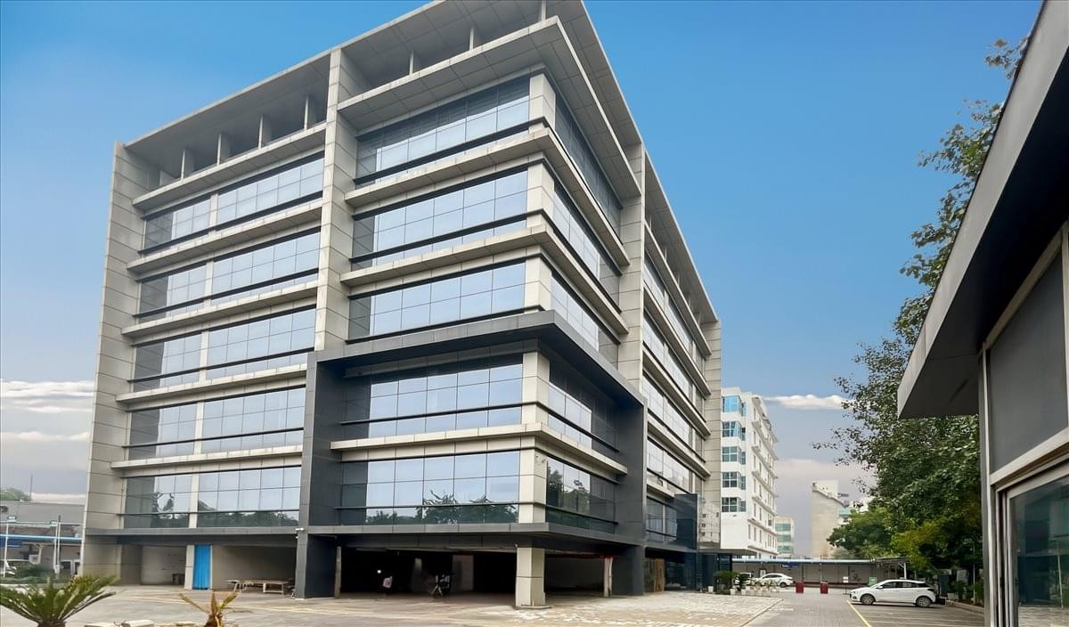 Exterior view of the modern glass-facade building at Plot no. 5, Sector-35, NH-8, Tech Garden.