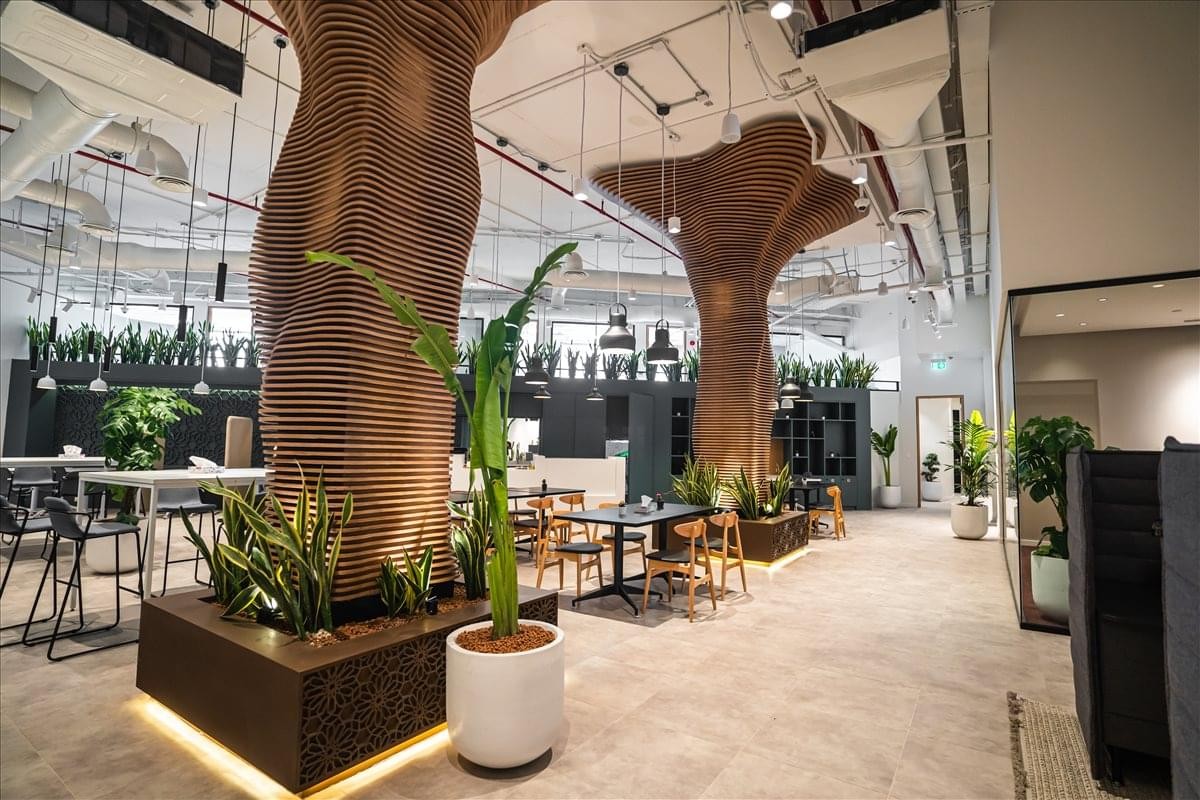 Spacious communal lounge at Prince Turki Ibn Abdulaziz Al Awwal Road, The Esplanade with unique tree-like columns.