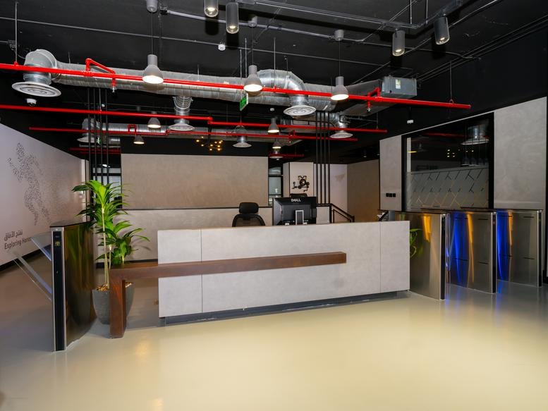 Lobby at Prince Turki Ibn Abdulaziz Al Awwal Rd featuring a sleek white reception desk and wooden accents.