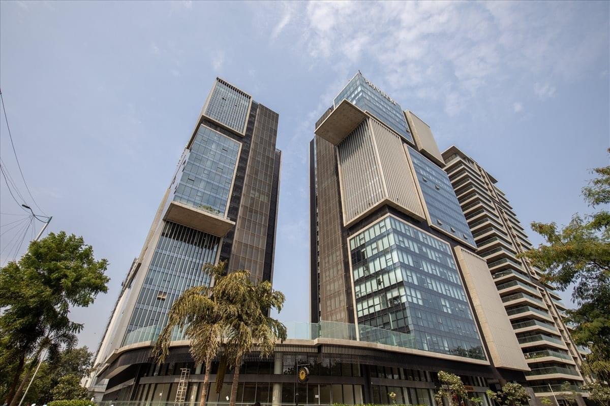 Exterior view of the modern glass-facade towers at Privillion, East Wing, SG Highway, Ahmedabad.