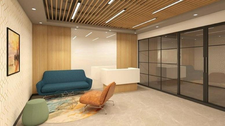Reception area at Residency Square, 6 Richmond Road with a modern desk, blue sofa, and wood-slat ceiling.