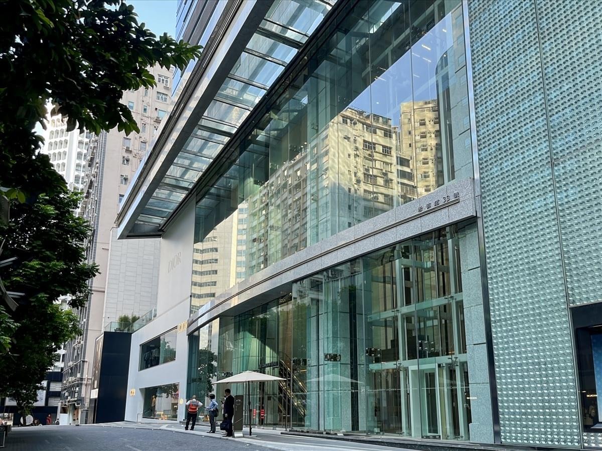 Modern glass exterior and entrance of Lee Garden One in Hong Kong.