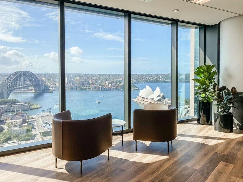 Lounge area at Salesforce Tower, Level 22 & 23, 180 George Street with views of the Sydney Harbour Bridge.