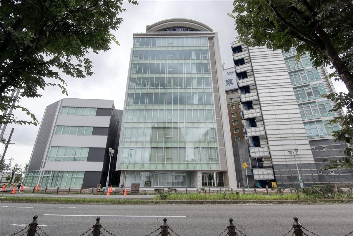 Exterior view of the glass-facade San Terrace Mikawa Anjo 6F building.