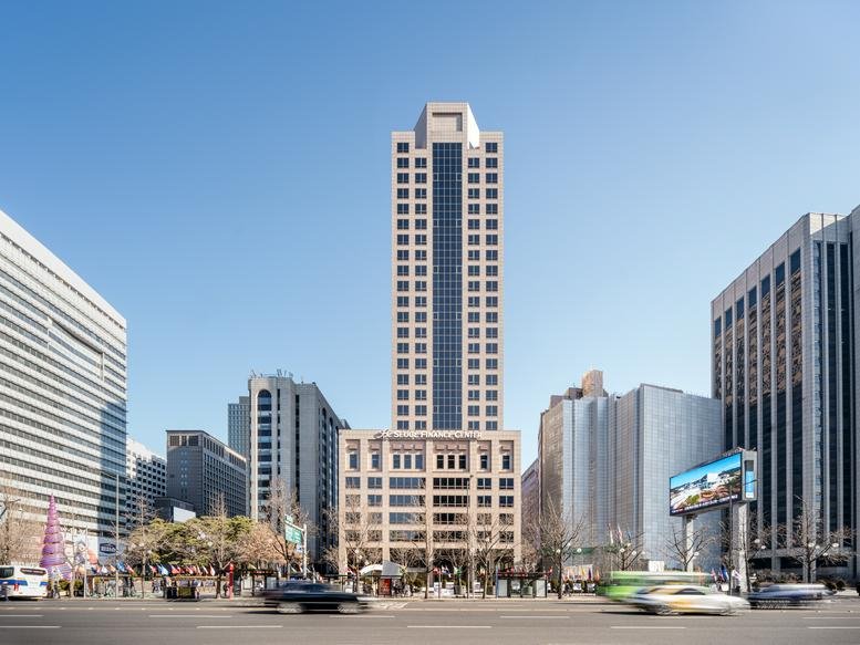 The tall, classic facade of the Seoul Finance Centre building under a clear blue sky.