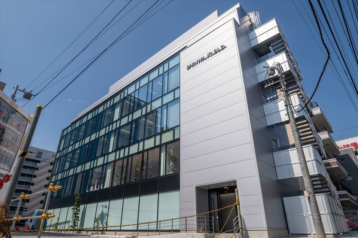 Exterior view of the glass and metal facade at the Shinwa KI Building 2F-5F.