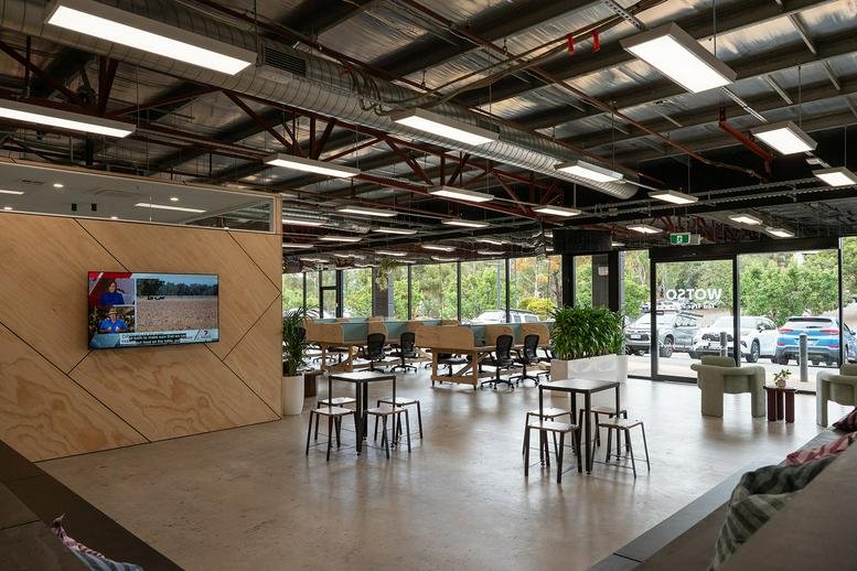 Spacious open-plan office at Shop 12/18, 1020 North East Road, Adelaide with large windows and varied seating.