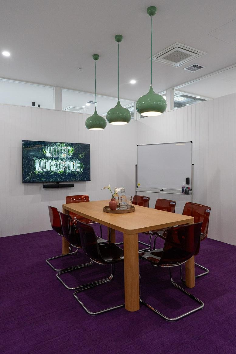 Professional meeting room at Shop 12/18, 1020 North East Road with purple carpet and green pendant lights.