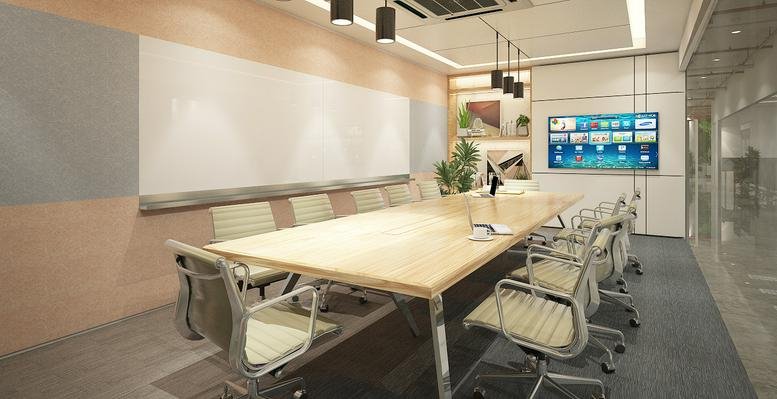 Meeting room at 1Skyrise 4, West Geonzon Street with a long wooden table and built-in whiteboard.