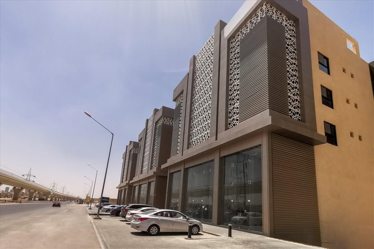 Exterior facade of the modern Spring Towers building on Prince Mohammed Ibn Salman Road.