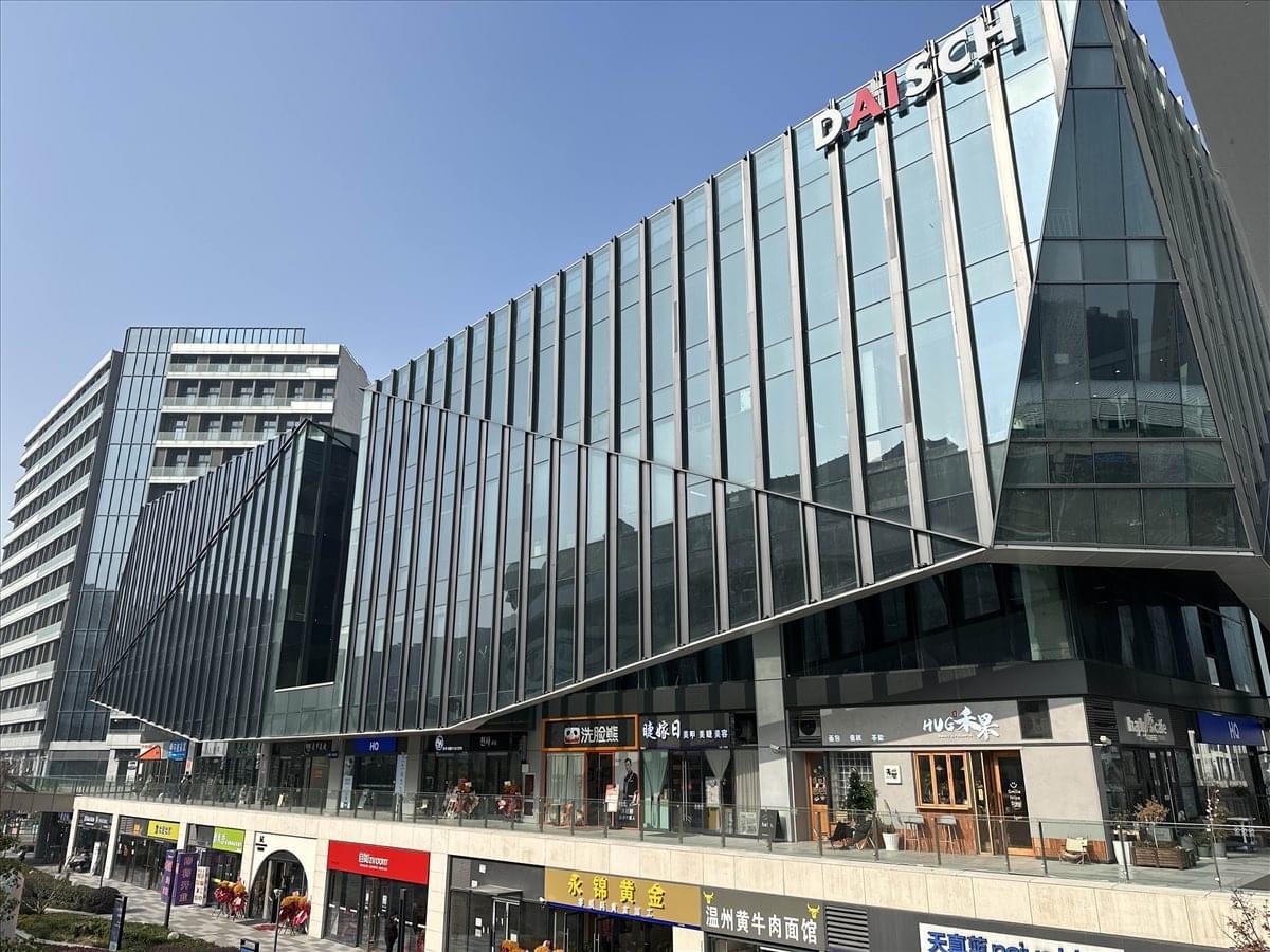 Exterior view of the contemporary glass and steel facade at Sunac West Ring Center.