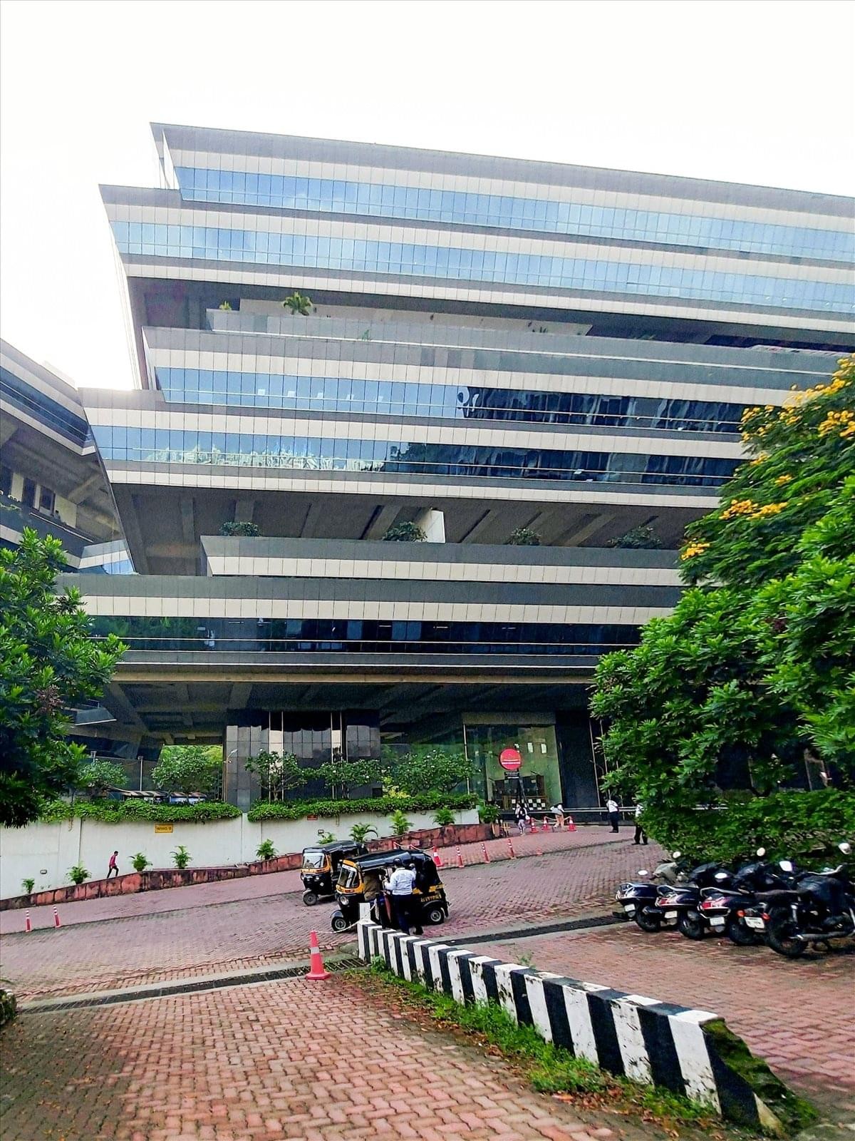 Exterior view of the multi-tiered glass facade at Supreme Business Park.