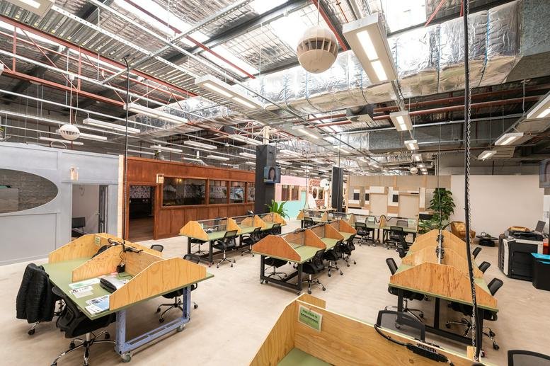 Spacious open-plan workspace at Tenancy 4023, Westpoint, 17 Patrick Street with industrial ceilings and modern desks.