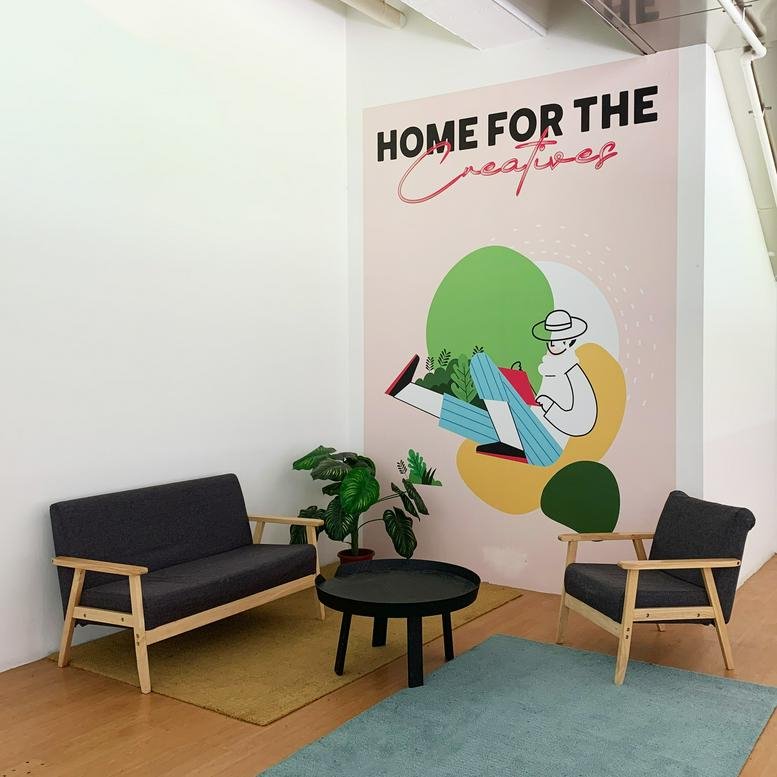 Spacious communal lounge at The Granstand, 200 Turf Club Road, featuring a colorful wall mural and modern seating.