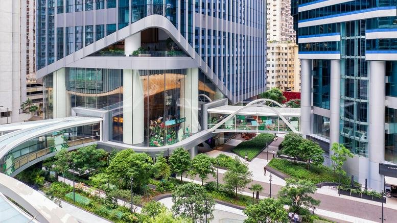Exterior view of the modern glass facade and landscaped plaza at One Taikoo Place.