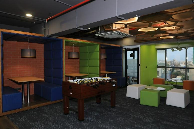Colorful breakout area at 7th Floor, The Link, Vijay Cross Road with foosball table and private booths.