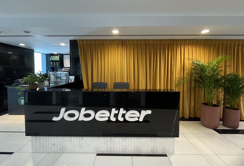Professional reception area for The One Tower, Sheikh Zayed Road, Dubai with a black marble desk.