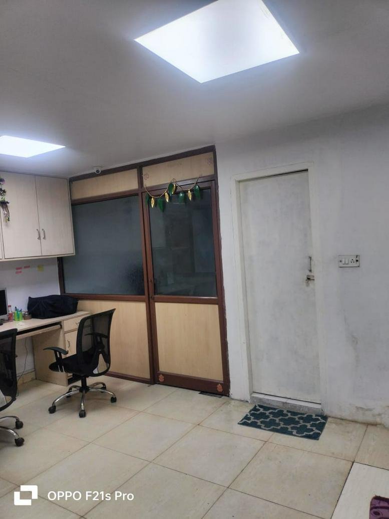 Bright workspace at Trilegient Coworking, 808, Devika Tower, Nehru Place, New Delhi with wooden partitions.