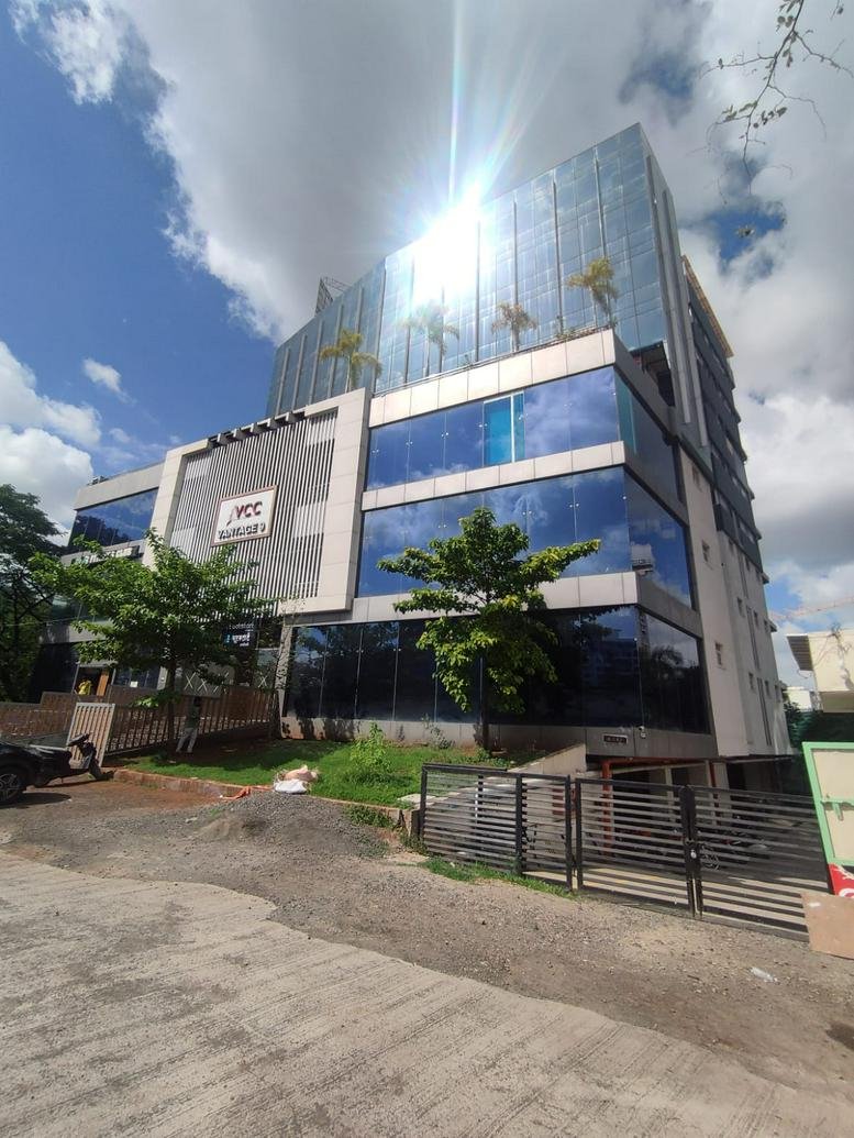 Exterior view of the modern glass-facade building at VCC, Vantage 9 in Pune.