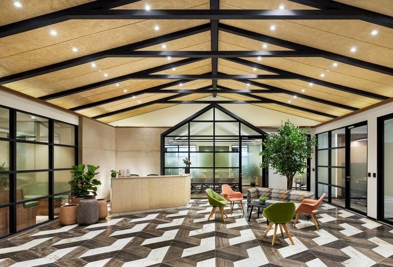 Spacious reception at Level 3, Palace Road, High Grounds with geometric flooring and vaulted wood-beam ceiling.