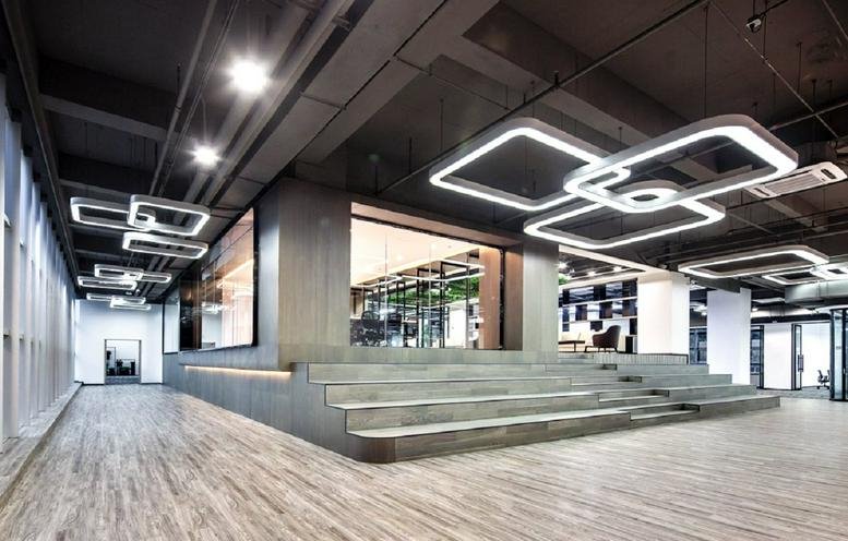 Spacious communal area at Xinhao E Du, Podium Building, featuring a tiered wooden seating staircase.