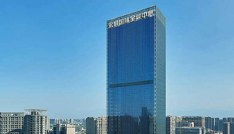 Exterior view of the blue glass skyscraper known as the Yongli International Finance Center.