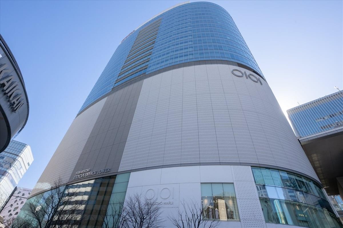 Low-angle exterior view of the modern Yurakucho Building, 2-7-1 Yurakucho, Tokyo.