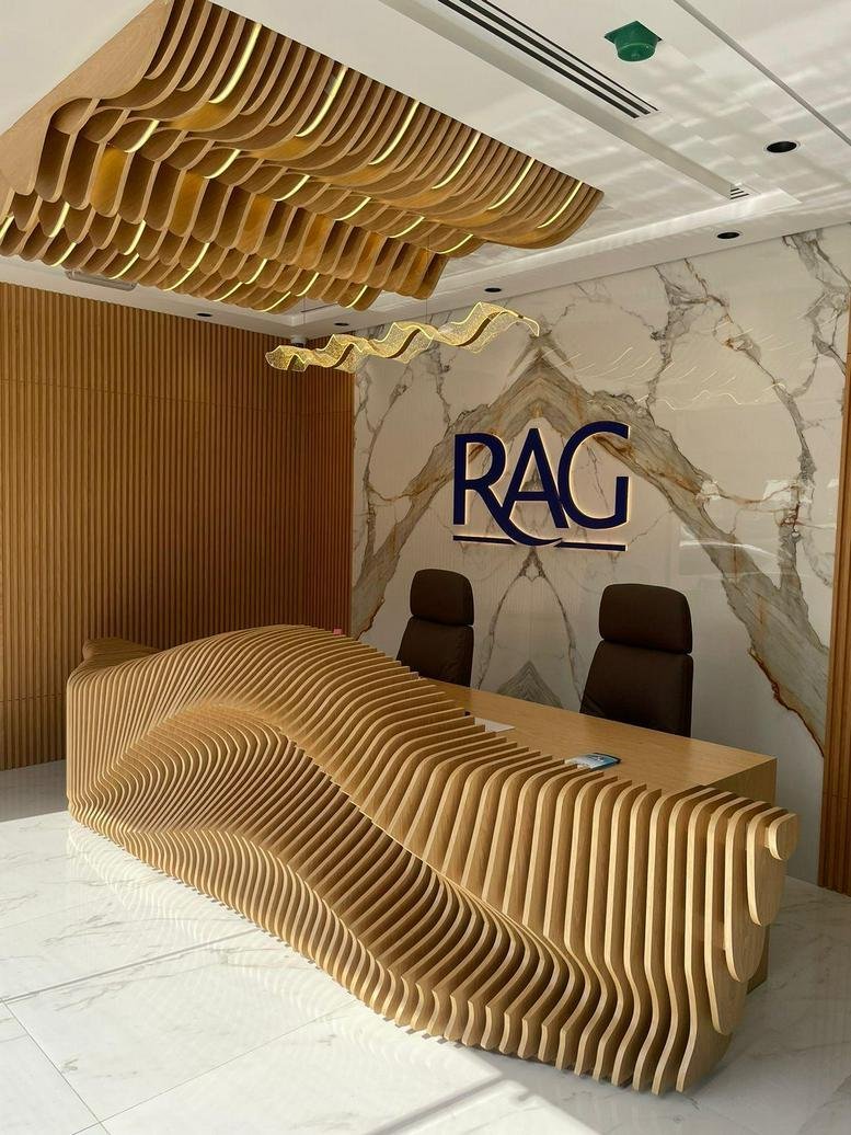 The stylish reception at Sheikh Zayed Road, Business Bay Metro station with a wave-pattern desk.