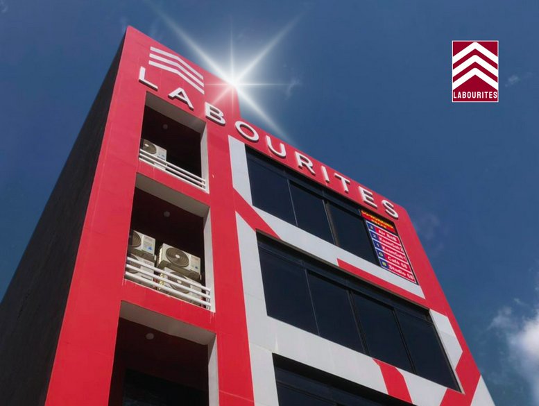 Exterior view of the red and white facade at Street 26A building.